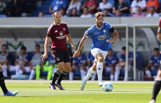 25.08.2024, xdcx, Fussball 2. Bundesliga, SV Darmstadt 98 - 1. FC Nürnberg, emonline, emspor, despor, v.l., Julian Justvan (1. FC Nürnberg), Killian Corredor (SV Darmstadt 98) DFL DFB REGULATIONS PROHIBIT ANY USE OF PHOTOGRAPHS AS IMAGE SEQUENCES AND OR QUASI-VIDEO.