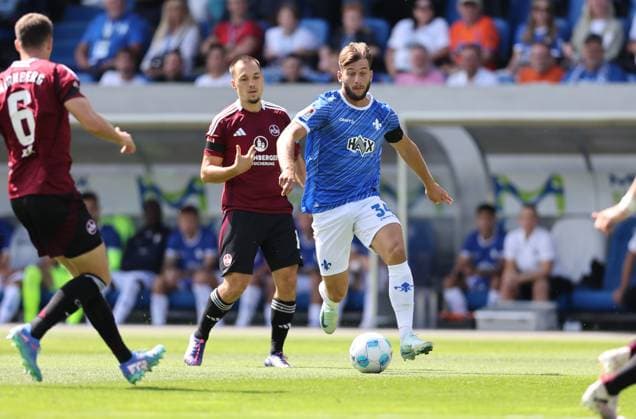 25.08.2024, xdcx, Fussball 2. Bundesliga, SV Darmstadt 98 - 1. FC Nürnberg, emonline, emspor, despor, v.l., Julian Justvan (1. FC Nürnberg), Killian Corredor (SV Darmstadt 98) DFL DFB REGULATIONS PROHIBIT ANY USE OF PHOTOGRAPHS AS IMAGE SEQUENCES AND OR QUASI-VIDEO.