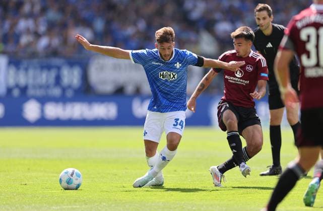 25.08.2024, xdcx, Fussball 2. Bundesliga, SV Darmstadt 98 - 1. FC Nürnberg, emonline, emspor, despor, v.l., Killian Corredor (SV Darmstadt 98), Jens Castrop (1. FC Nürnberg) DFL DFB REGULATIONS PROHIBIT ANY USE OF PHOTOGRAPHS AS IMAGE SEQUENCES AND OR QUASI-VIDEO.