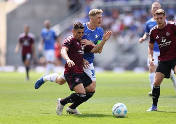 25.08.2024, xdcx, Fussball 2. Bundesliga, SV Darmstadt 98 - 1. FC Nürnberg, emonline, emspor, despor, v.l., Danilo Soares (1. FC Nürnberg), Clemens Riedel (SV Darmstadt 98) DFL DFB REGULATIONS PROHIBIT ANY USE OF PHOTOGRAPHS AS IMAGE SEQUENCES AND OR QUASI-VIDEO.