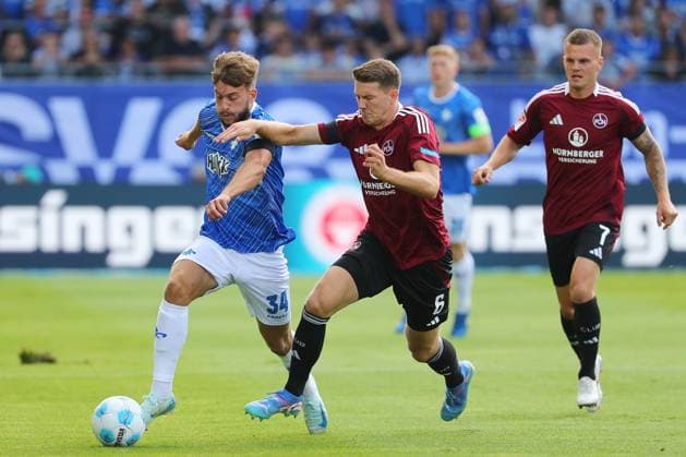 25.08.2024, xtvx, Fussball 2.Bundesliga, SV Darmstadt 98 - 1.FC Nürnberg emspor, v.l. Zweikampf, Duell, duel, tackle, compete d34< Florian Flick (1. FC Nuernberg) (DFL DFB REGULATIONS PROHIBIT ANY USE OF PHOTOGRAPHS as IMAGE SEQUENCES and or QUASI-VIDEO) Darmstadt