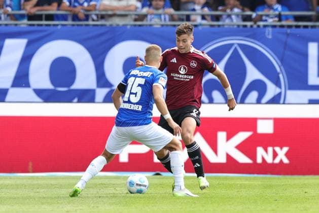 25.08.2024 - Fussball - Saison 2024 2025 - 2. Fussball - Bundesliga - 03. Spieltag: SV Darmstadt 98 SVD D98 ( Lilien ) - 1. FC Nürnberg FCN ( Club ) - Sportfoto Zink DaMa - xdaxmax - DFL regulations prohibit any use of photographs as image sequences and or quasi-video - only for editorial use - Fabian Nürnberger Nuernberger (15, SV Darmstadt 98 D98 SV98 ) Stefanos Tzimas (9, 1. FC Nürnberg FCN )