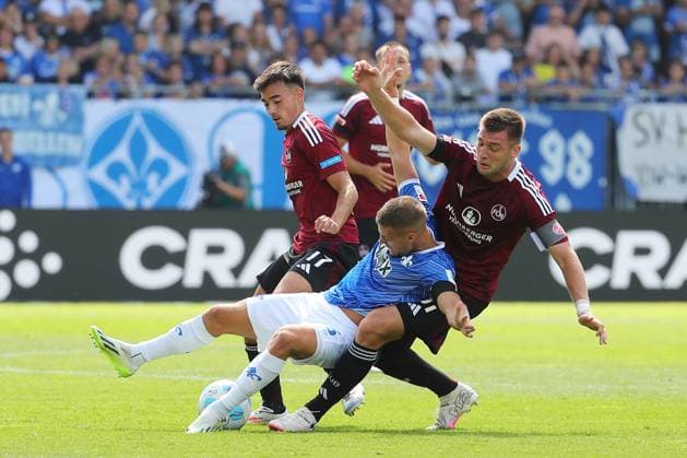 25.08.2024, xtvx, Fussball 2.Bundesliga, SV Darmstadt 98 - 1.FC Nürnberg emspor, v.l. Zweikampf, Duell, duel, tackle, compete Fabian Nuernberger (SV Darmstadt 98) Robin Koch (1. FC Nuernberg) (DFL DFB REGULATIONS PROHIBIT ANY USE OF PHOTOGRAPHS as IMAGE SEQUENCES and or QUASI-VIDEO) Darmstadt