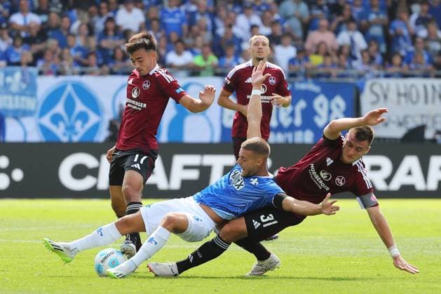 25.08.2024, xtvx, Fussball 2.Bundesliga, SV Darmstadt 98 - 1.FC Nürnberg emspor, v.l. Zweikampf, Duell, duel, tackle, compete Fabian Nuernberger (SV Darmstadt 98) Robin Koch (1. FC Nuernberg) (DFL DFB REGULATIONS PROHIBIT ANY USE OF PHOTOGRAPHS as IMAGE SEQUENCES and or QUASI-VIDEO) Darmstadt