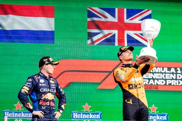ZANDVOORT - Max Verstappen (Red Bull Racing) and Lando Norris (McLaren) on the podium after the F1 Grand Prix of the Netherlands at the Circuit of Zandvoort. ANP SEM VAN DER WAL xVIxANPxSportx xxANPxIVx 506727679 originalFilename: 506727679.jpg