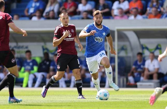 25.08.2024, xdcx, Fussball 2. Bundesliga, SV Darmstadt 98 - 1. FC Nürnberg, emonline, emspor, despor, v.l., Julian Justvan (1. FC Nürnberg), Killian Corredor (SV Darmstadt 98) DFL DFB REGULATIONS PROHIBIT ANY USE OF PHOTOGRAPHS AS IMAGE SEQUENCES AND OR QUASI-VIDEO.