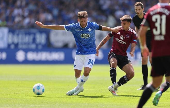 25.08.2024, xdcx, Fussball 2. Bundesliga, SV Darmstadt 98 - 1. FC Nürnberg, emonline, emspor, despor, v.l., Killian Corredor (SV Darmstadt 98), Jens Castrop (1. FC Nürnberg) DFL DFB REGULATIONS PROHIBIT ANY USE OF PHOTOGRAPHS AS IMAGE SEQUENCES AND OR QUASI-VIDEO.