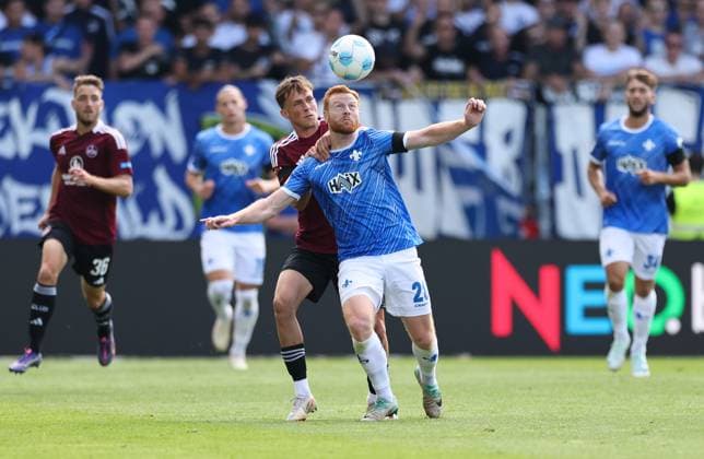 25.08.2024, xdcx, Fussball 2. Bundesliga, SV Darmstadt 98 - 1. FC Nürnberg, emonline, emspor, despor, v.l., Michal Sevcik (1. FC Nürnberg), Paul Will (SV Darmstadt 98) DFL DFB REGULATIONS PROHIBIT ANY USE OF PHOTOGRAPHS AS IMAGE SEQUENCES AND OR QUASI-VIDEO.