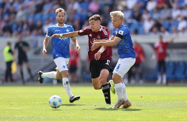 25.08.2024, xdcx, Fussball 2. Bundesliga, SV Darmstadt 98 - 1. FC Nürnberg, emonline, emspor, despor, v.l., Stefanos Tzimas (1. FC Nürnberg), Andreas Müller (SV Darmstadt 98) DFL DFB REGULATIONS PROHIBIT ANY USE OF PHOTOGRAPHS AS IMAGE SEQUENCES AND OR QUASI-VIDEO.