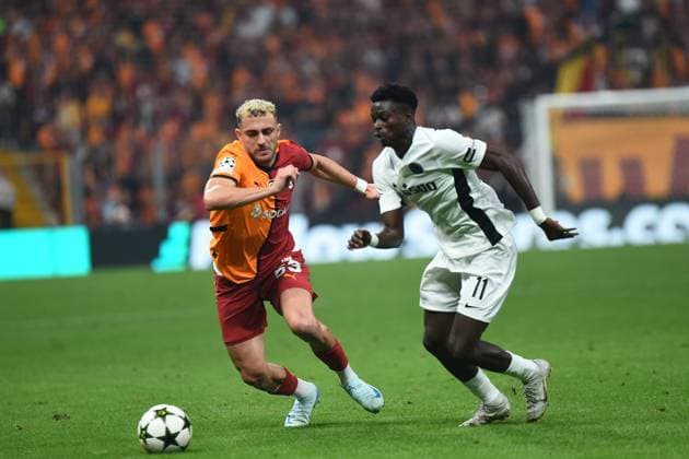 Baris Alper Yilmaz of Galatasaray and Ebrima Colley (11) of Young Boys during the UEFA Champions League Play-Offs Second Leg match between Galatasaray and Young Boys at Rams Park Stadium in Istanbul , Turkey on August 27 , 2024. ( Photo by Seskimphoto ) Galatasaray v Young Boys - UEFA Champions League Play-Offs Second Leg 