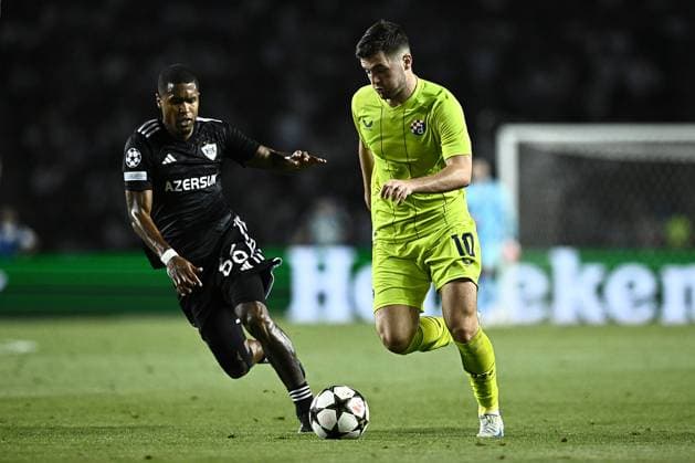 Qarabag v GNK Dinamo Zagreb - UEFA Champions Qualifying Play-Off: Second Leg BAKU, AZERBAIJAN - AUGUST 28: Martin Baturina of Dinamo Zagreb in action against Patrick Andrade of Qarabag during the UEFA Champions Qualifying Play-Off Second Leg match between Qarabag and GNK Dinamo Zagreb at Tofiq Bahramov Stadium on August 28, 2024 in Baku, Azerbaijan.  MarkoxLukunic PIXSELL