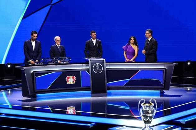 29th of August 2024 - UEFA CHAMPIONS LEAGUE KICK OFF 2024 2025 - DRAW LOTTERY WITH AI - FORUM GRIMALDI A general view with Bayer 04 Leverkusen Logo during the draw lottery with buffon (gianluigi) and ronaldo (cristiano) with chowdhury (reshmin) with pinto (pedro) MONACO MONACO Copyright: xSPORTPIXPRESSx xFREDxPORCUx