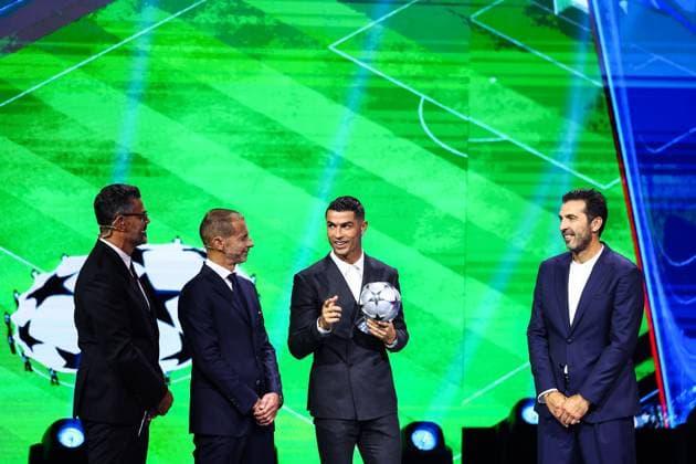 29th of August 2024 - UEFA CHAMPIONS LEAGUE KICK OFF 2024 2025 - DRAW LOTTERY WITH AI - FORUM GRIMALDI ronaldo (cristiano) happiness after he receives a trophy by the UEFA president ceferin (aleksander) on the sight of buffon (gianluigi) and pinto (pedro) MONACO MONACO Copyright: xSPORTPIXPRESSx xFREDxPORCUx
