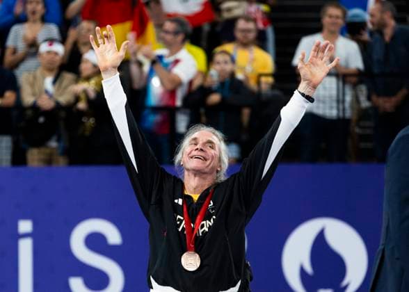 PARIS, FRANCE - SEPTEMBER 02: Thomas WANDSCHNEIDER (GER), startclass WH1 wins the bronce medal and celebrates during the winning ceremony Paris 2024 Summer Paralympic Games at Porte de la Chapelle Arena on September 02, 2024 in Paris, France. (Photo by Mika Volkmann DBS)