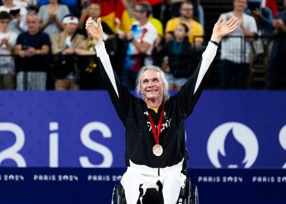 PARIS, FRANCE - SEPTEMBER 02: Thomas WANDSCHNEIDER (GER), startclass WH1 wins the bronce medal and celebrates during the winning ceremony Paris 2024 Summer Paralympic Games at Porte de la Chapelle Arena on September 02, 2024 in Paris, France. (Photo by Mika Volkmann DBS)