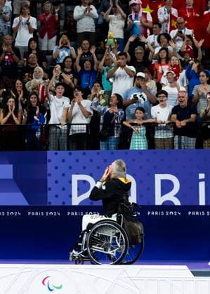 PARIS, FRANCE - SEPTEMBER 02: Thomas WANDSCHNEIDER (GER), startclass WH1 wins the bronce medal and celebrates during the winning ceremony Paris 2024 Summer Paralympic Games at Porte de la Chapelle Arena on September 02, 2024 in Paris, France. (Photo by Mika Volkmann DBS)