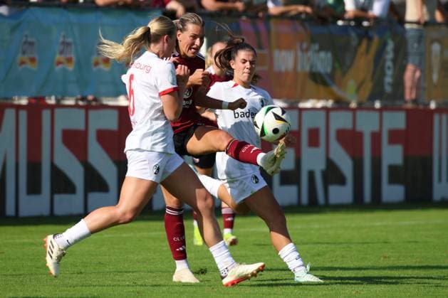 07.09.2024 - Fussball - Saison 2024 2025 - DFB-Pokal Frauen : 1. FC Nürnberg FCN ( Club Clubfrauen ) - SC Freiburg - Sportfoto Zink - xdcxdex - Annie Lee Karich ( 6, SC Freiburg ), Medina Desic (10, 1. FC Nürnberg FCN ), Leela Egli ( 20 , SC Freiburg )