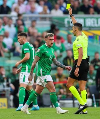 UEFA Nations League Group B2, Aviva Stadium, Dublin 7 9 2024 Republic of Ireland vs England Sammie Szmodics of Ireland is shown a yellow card by Referee JosÃ Sammie Szmodics is shown a yellow card by JosÃ Maria Sanchez 7 9 2024  Copyright: x INPHO JamesxCrombiex JRY14158