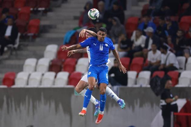 Budapest, Hungary, 9th September 2024. Alessandro Bastoni of Italy and Mohammad Abu Fani of Israel contest for an aerial ball during the UEFA Nations League match at Bozsik Arena, Budapest. Picture credit should read: Jonathan Moscrop Sportimage EDITORIAL USE ONLY. No use with unauthorised audio, video, data, fixture lists, club league logos or live services. Online in-match use limited to 120 images, no video emulation. No use in betting, games or single club league player publications. SPI-3292-0024