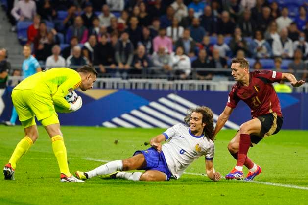 France v Belgium - UEFA Nations League LYON, FRANCE - SEPTEMBER 09 : Castagne Timothy defender of Belgium, Casteels Koen goalkeeper of Belgium and Guendouzi Matteo midfielder of France during the UEFA Nations League match in group A2 between France and Belgium on September 9, 2024 in Lyon, France, 09 09 2024 Lyon France  Copyright: xJanxDexMeuleneirx