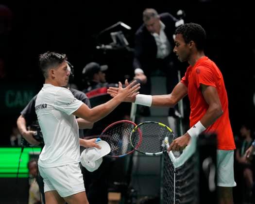 10th September 2024; AO Arena, Manchester, England; Davis Cup Finals, Group Stage, Group D Day 1; Felix Auger-Aliassime of Canada shakes hands with Sebastian Baez of Argentina after his victory 6-3, 6-3 to give Canada a 2-0 lead in the tie  ActionPlus12691075 StevenxFlynn
