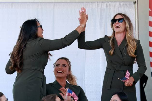 GAINESVILLE, VA - SEPTEMBER 12: Team USA golfer Lexi Thompson watches as Lilia Vu and Sarah Schmelzel who are paired together high five when the pairings are announced during the Opening Ceremony for the 2024 Solheim Cup on September 12th, 2024, at the Robert Trent Jones Golf Club in Gainesville, Virginia. (Photo by Brian Spurlock Icon Sportswire) GOLF: SEP 12 Solheim Cup Opening Ceremony EDITORIAL USE ONLY Icon24091211
