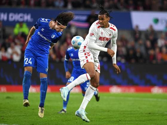 Jean Hugonet (1. FC Magdeburg) und Damion Downs (1. FC Koeln) im Zweikampf waehrend des Spiels der 2. Bundesliga zwischen 1. FC Köln und 1. FC Magdeburg im RheinEnergieStadion am 14. September 2024 in Köln, Deutschland. (Foto von Ralf Treese DeFodi Images) +++ Jean Hugonet (1. FC Magdeburg) und Damion Downs (1. FC Koeln) battle for the ball during the 2. Bundesliga match between 1. FC Köln and 1. FC Magdeburg at RheinEnergieStadion on September 14, 2024 in Cologne, Germany. (Photo by Ralf Treese DeFodi Images) DFB DFL REGULATIONS PROHIBIT ANY USE OF PHOTOGRAPHS AS IMAGE SEQUENCES AND OR QUASI-VIDEO. Defodi-521_KOEFCM20240914_002