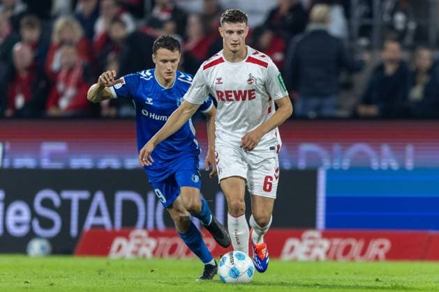 Fußball 2. Bundesliga 5. Spieltag 1. FC Köln - 1. FC Magdeburg am 14.09.2024 im RheinEnergieStadion in Köln Martijn Kaars ( Magdeburg ), links - Eric Martel ( Köln ), rechts DFB regulations prohibit any use of photographs as image sequences and or quasi-video.