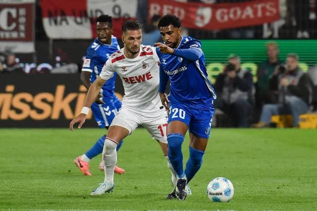 v. li. im Zweikampf Leart Pacarada (Koeln 17) Xavier Amaechi (Magdeburg 20) 14.09.2024 Fussball 1. FC Koeln vs 1. FC Magdeburg, Rheinenergiestadion, Koeln, DFB DFL REGULATIONS PROHIBIT ANY USE OF PHOTOGRAPHS AS IMAGE SEQUENCES AND OR QUASI-VIDEO NRW Germany
