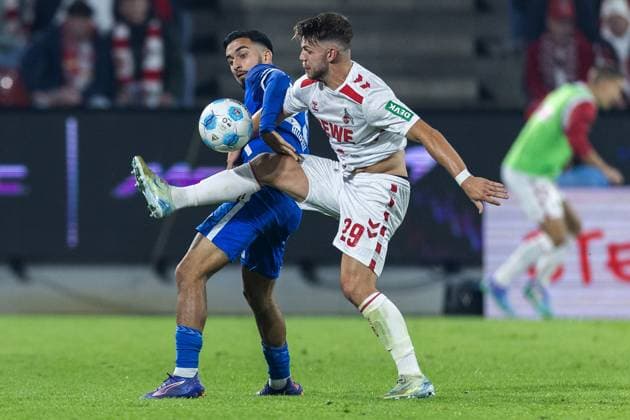 Fußball 2. Bundesliga 5. Spieltag 1. FC Köln - 1. FC Magdeburg am 14.09.2024 im RheinEnergieStadion in Köln Jan Thielmann ( Köln ), vorne - Baris Atik ( Magdeburg ), hinten DFB regulations prohibit any use of photographs as image sequences and or quasi-video.