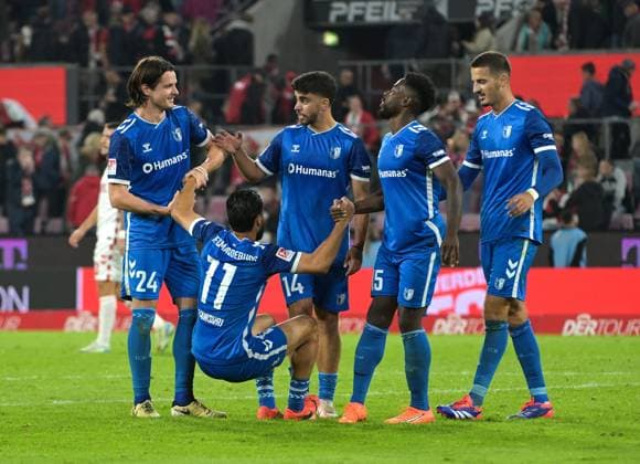 14.09.2024, xjpx, Fussball 2.Bundesliga, 1.FC Koeln - 1.FC Magdeburg emspor, v.l. Ausgelassene Freude bei den Spielern aus Magdeburg, nach dem 2:1 Sieg gegen den 1. FC Koeln. v.l. Jean Hugonet (Magdeburg) - Abu-Bekir Ömer El-Zein (Magdeburg) - Daniel Heber (Magdeburg) - im Vordergrund Mohammed El Hankouri (Magdeburg) (DFL DFB REGULATIONS PROHIBIT ANY USE OF PHOTOGRAPHS as IMAGE SEQUENCES and or QUASI-VIDEO) Koeln