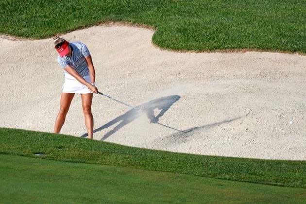 GAINESVILLE, VA - SEPTEMBER 14: Team USA golfer Lexi Thompson hits out of a fairway bunker on the 15th hole during Saturday Four-Ball during the 2024 Solheim Cup on September 14, 2024 at Robert Trent Jones Golf Club at Gainesville, Virginia. (Photo by Brian Spurlock Icon Sportswire) GOLF: SEP 14 Solheim Cup EDITORIAL USE ONLY Icon24091486