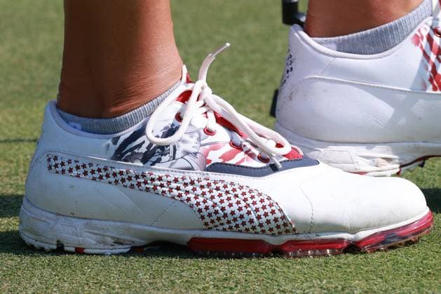 GAINESVILLE, VA - SEPTEMBER 14: A detailed close up of the shoes worn by USA golfer Lexi Thompson signs autographs after she finishes on the 16th hole during Saturday Foursomes during the 2024 Solheim Cup on September 14, 2024 at Robert Trent Jones Golf Club at Gainesville, Virginia. (Photo by Brian Spurlock Icon Sportswire) GOLF: SEP 14 Solheim Cup EDITORIAL USE ONLY Icon240914104