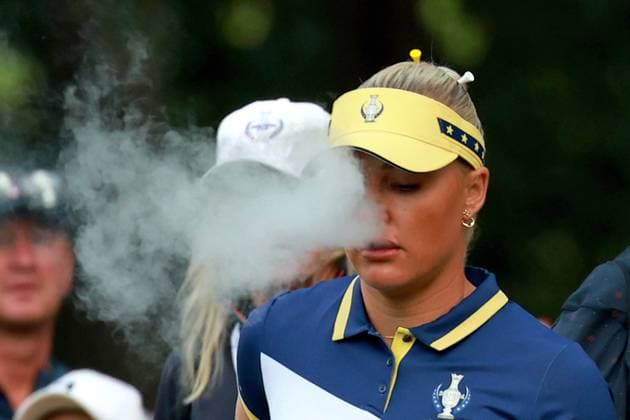 GAINESVILLE, VA - SEPTEMBER 15: Europe golfer Charley Hull blows smoke from a vape on the first hole during the Sunday Singles at the 2024 Solheim Cup on September 15, 2024, at the Robert Trent Jones Golf Club in Gainesville, Virginia. (Photo by Brian Spurlock Icon Sportswire) GOLF: SEP 15 Solheim Cup EDITORIAL USE ONLY Icon2409154