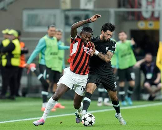 Rafael Leao (AC Milan) and Dominik Szoboszlai (Liverpool FC) battle for the ball, UEFA Champions League 2024 25 League Phase MD1, AC Milan v Liverpool FC, Stadio Giuseppe Meazza (San Siro), September 17, 2024, Milan, Italy.