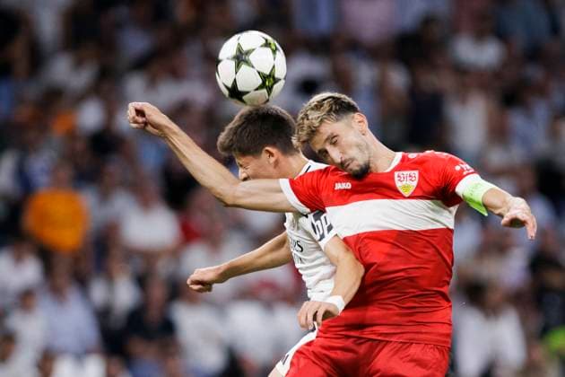 UEFA CHAMPIONS LEAGUE - Real Madrid vs VfB Stuttgart MADRID, SPAIN - SEPTEMBER 17: Arda Guler of Real Madrid and Atakan Karazor of VfB Stuttgart fight for the ball during the UEFA CHAMPIONS LEAGUE 2024 25 match between Real Madrid and VfB Stuttgart at Santiago Bernabeu Stadium. (Photo by Guillermo Martinez) Madrid Santiago BernabŽu Stadium Spain Copyright: xGuillermoxMartinezx