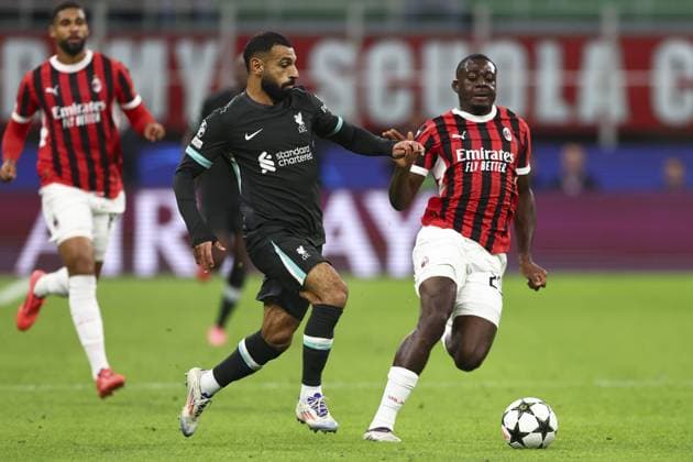 Mohamed Salah of Liverpool chased by Youssouf Fofana of Milan AC Milan v Liverpool, UEFA Champions League, Group Stage, Football, San Siro, Milan, Italy, 17 Sep 2024 EDITORIAL USE ONLY No use with unauthorised audio, video, data, fixture lists, club league logos or live services. Online in-match use limited to 120 images, no video emulation. No use in betting, games or single club league player publications.  Copyright: xSimonxDael Shutterstockx 14722111cl
