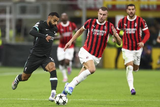 Mohamed Salah of Liverpool chased by Strahinja Pavlovic of Milan AC Milan v Liverpool, UEFA Champions League, Group Stage, Football, San Siro, Milan, Italy, 17 Sep 2024 EDITORIAL USE ONLY No use with unauthorised audio, video, data, fixture lists, club league logos or live services. Online in-match use limited to 120 images, no video emulation. No use in betting, games or single club league player publications.  Copyright: xSimonxDael Shutterstockx 14722111ck