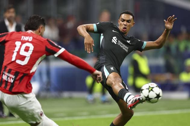 Trent Alexander-Arnold of Liverpool and Theo Hernandez of Milan battle for the ball AC Milan v Liverpool, UEFA Champions League, Group Stage, Football, San Siro, Milan, Italy, 17 Sep 2024 EDITORIAL USE ONLY No use with unauthorised audio, video, data, fixture lists, club league logos or live services. Online in-match use limited to 120 images, no video emulation. No use in betting, games or single club league player publications.  Copyright: xSimonxDael Shutterstockx 14722111cc