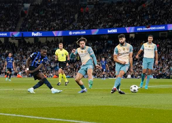 Manchester, England, 18th September 2024. Marcus Thuram of Inter Milan takes an early shot during the UEFA Champions League match at the Etihad Stadium, Manchester. Picture credit should read: Andrew Yates Sportimage EDITORIAL USE ONLY. No use with unauthorised audio, video, data, fixture lists, club league logos or live services. Online in-match use limited to 120 images, no video emulation. No use in betting, games or single club league player publications. SPI-3321-0032