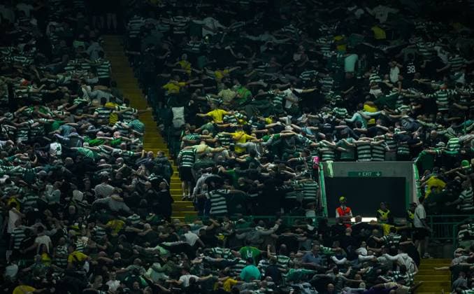 Celtic fans do a huddle in the stands. Celtic v Slovan Bratislava, UEFA Champions League, Group Stage, Football, Celtic Park, Glasgow, Scotland, UK, 18 Sep 2024 EDITORIAL USE ONLY No use with unauthorised audio, video, data, fixture lists, club league logos or live services. Online in-match use limited to 120 images, no video emulation. No use in betting, games or single club league player publications. Copyright: xStuartxWallace Shutterstockx 14722221aq