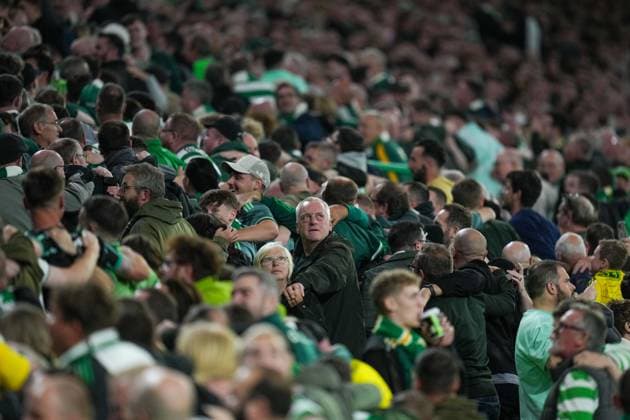 Celtic fans do a huddle in the stands. Celtic v Slovan Bratislava, UEFA Champions League, Group Stage, Football, Celtic Park, Glasgow, Scotland, UK, 18 Sep 2024 EDITORIAL USE ONLY No use with unauthorised audio, video, data, fixture lists, club league logos or live services. Online in-match use limited to 120 images, no video emulation. No use in betting, games or single club league player publications. Copyright: xStuartxWallace Shutterstockx 14722221ap