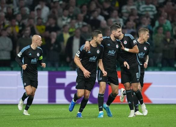 Kevin Wimmer of Slovan Bratislava celebrates with team mates after scoring to reduce Celtic s lead to 3-1. Celtic v Slovan Bratislava, UEFA Champions League, Group Stage, Football, Celtic Park, Glasgow, Scotland, UK, 18 Sep 2024 EDITORIAL USE ONLY No use with unauthorised audio, video, data, fixture lists, club league logos or live services. Online in-match use limited to 120 images, no video emulation. No use in betting, games or single club league player publications. Copyright: xStuartxWallace Shutterstockx 14722221au