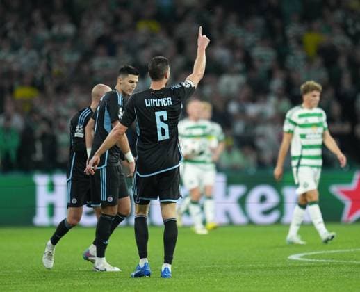 Kevin Wimmer of Slovan Bratislava celebrates with team mates after scoring to reduce Celtic s lead to 3-1. Celtic v Slovan Bratislava, UEFA Champions League, Group Stage, Football, Celtic Park, Glasgow, Scotland, UK, 18 Sep 2024 EDITORIAL USE ONLY No use with unauthorised audio, video, data, fixture lists, club league logos or live services. Online in-match use limited to 120 images, no video emulation. No use in betting, games or single club league player publications. Copyright: xStuartxWallace Shutterstockx 14722221at
