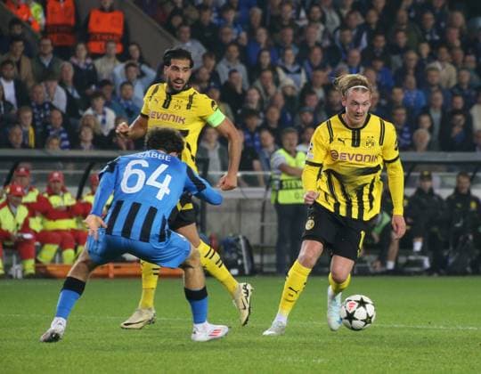 18.09.2024, xgrfx, Fussball UEFA Champions League, Club Brügge - Borussia Dortmund emspor, v.l. Kyriani Sabbe (Club Brügge), Julian Brandt (Borussia Dortmund) (DFL DFB REGULATIONS PROHIBIT ANY USE OF PHOTOGRAPHS as IMAGE SEQUENCES and or QUASI-VIDEO) Brügge