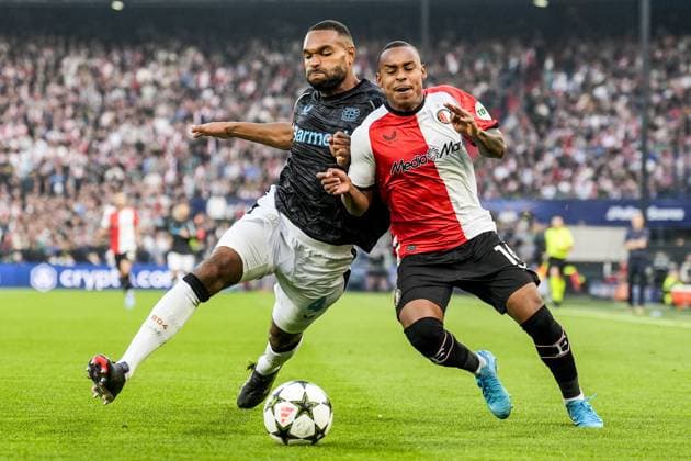 UEFA Champions League: Feyenoord v Bayer 04 Leverkusen Rotterdam - Jonathan Tah of Bayer 04 Leverkusen, Igor Paixao of Feyenoord during the first round of new format of the Champions League 2024 2025. The match is set between Feyenoord and Bayer 04 Leverkusen at Stadion Feijenoord De Kuip on 19 September 2024 in Rotterdam, The Netherlands. Copyright: xTomxBodex