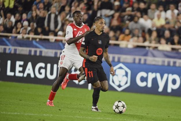 SINGO Wilfried (AS Monaco) and RAPHINHA (FC Barcelone). AS Monaco vs FC Barcelone UEFA Champions League in Stade Louis II, MONACO, on September 19, 2024. FOOTBALL: C1 - AS Monaco vs FC Barcelone - UEFA Champions League - 19 09 24 FredDides Panoramic 