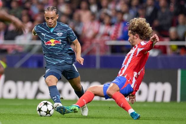 Antoine Griezmann of Atletico de Madrid battles for the ball with Arthur Vermeeren of RB Leipzig during the UEFA Champions League match between Atletico de Madrid v RB Leipzig at Stadium Civitas Metropolitano on September 19, 2024 in Madrid (Photo by: LGM) FOOTBALL : Atletico de Madrid vs RB Leipzig - UEFA Ligue des Champions - 19 09 2024 LGM Panoramic 