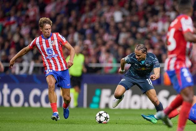 Arthur Vermeeren of RB Leipin battles for the ball with Marcos Llorente of Atletico de Madrid during the UEFA Champions League match between Atletico de Madrid v RB Leipzig at Stadium Civitas Metropolitano on September 19, 2024 in Madrid (Photo by: LGM) FOOTBALL : Atletico de Madrid vs RB Leipzig - UEFA Ligue des Champions - 19 09 2024 LGM Panoramic 