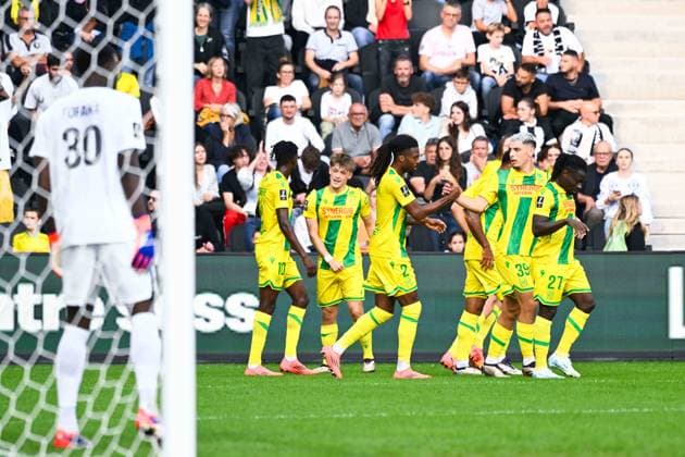 Johann Lepenant ( 8 - Nantes ) celebrates with teammates during the Ligue 1 match between Angers SCO and FC Nantes at Stade Raymond Kopa on September 22, 2024 in Angers, France. ( Photo by federico pestellini panoramic ) - FOOTBALL : Angers vs Nantes - Ligue 1 - 22 09 2024 FedericoPestellini Panoramic 